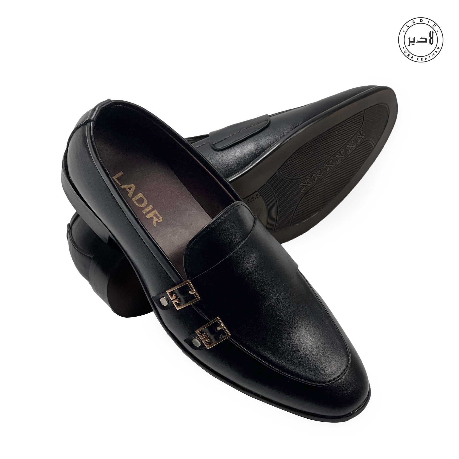 The LOAFER BLACK shoes for men displayed on a white surface, illustrating the timeless design and sophistication.