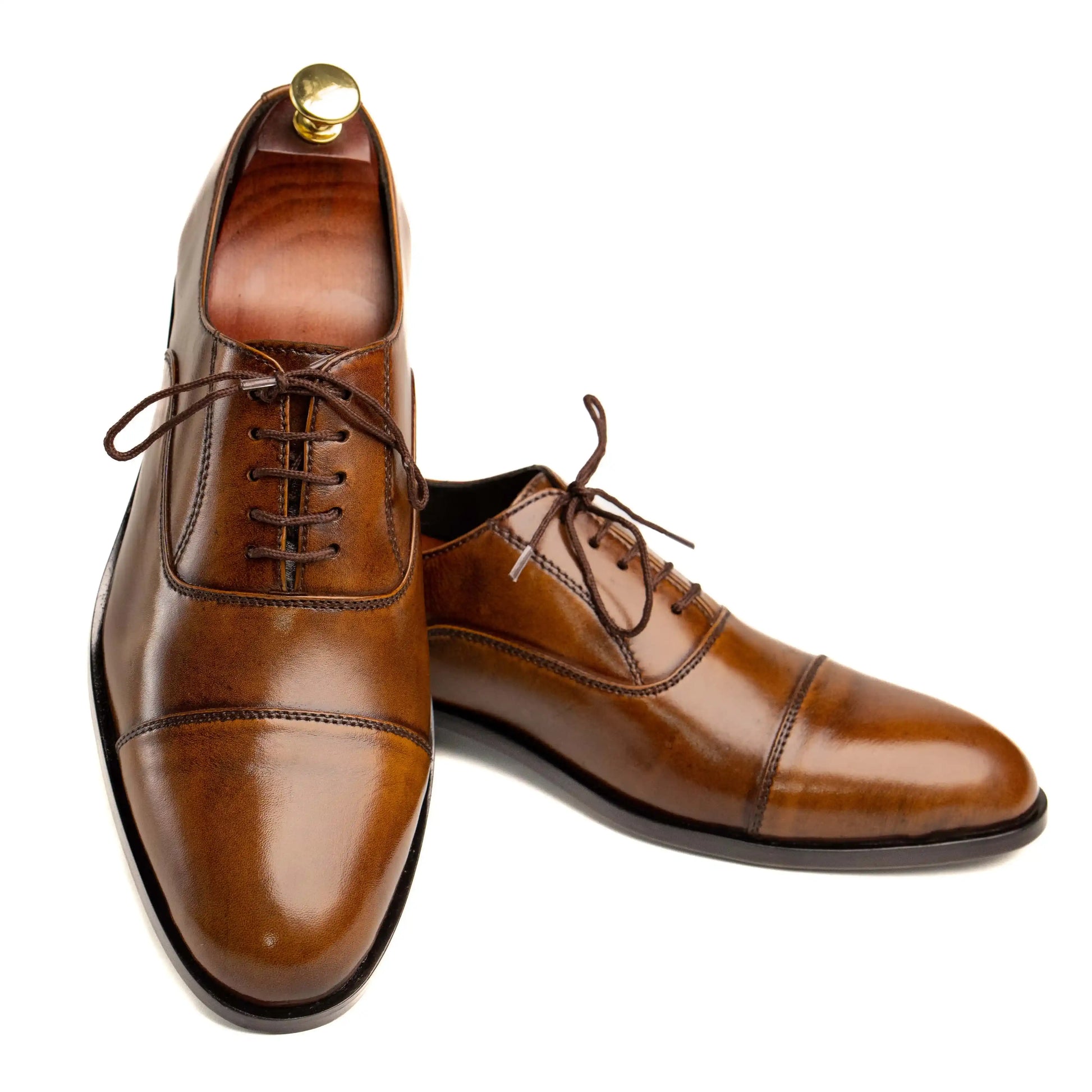 Front view of OXFORD CAROB dress shoes, showcasing a rich carob leather finish and elegant design for formal occasions.
